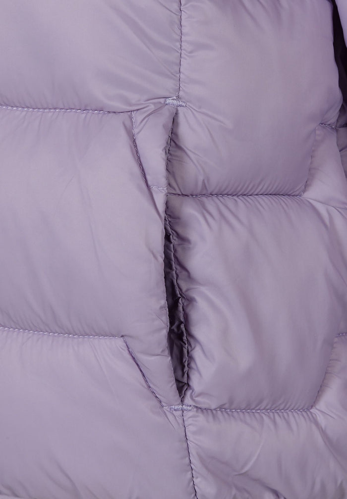 Detail of a lightweight purple nylon jacket with quilted padding and side pockets.