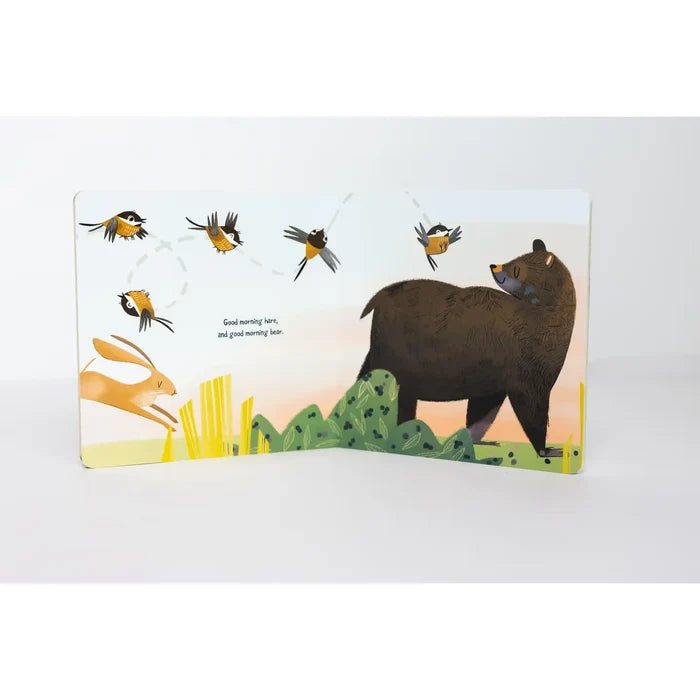 Illustration from Good Morning Mother Nature board book with a brown bear, a hopping rabbit, and several small birds against a pastel sky.