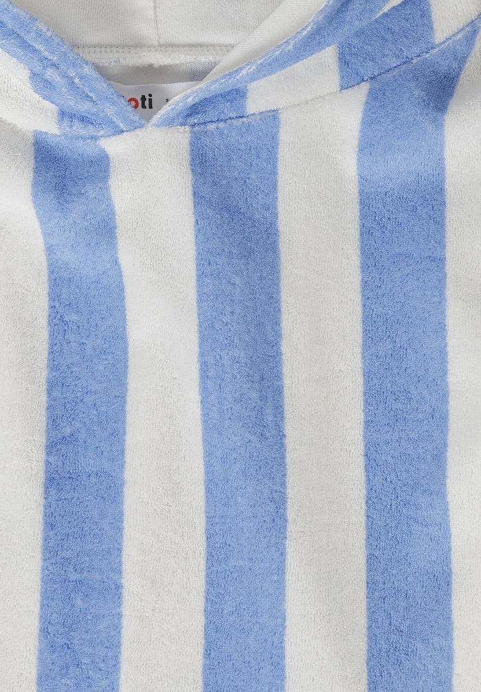 Detail of boys' hooded towelling cover up with blue and white stripes.