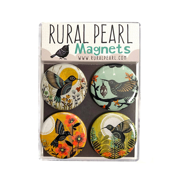 Set of four round magnets featuring hummingbird and floral illustrations on colorful backgrounds.
