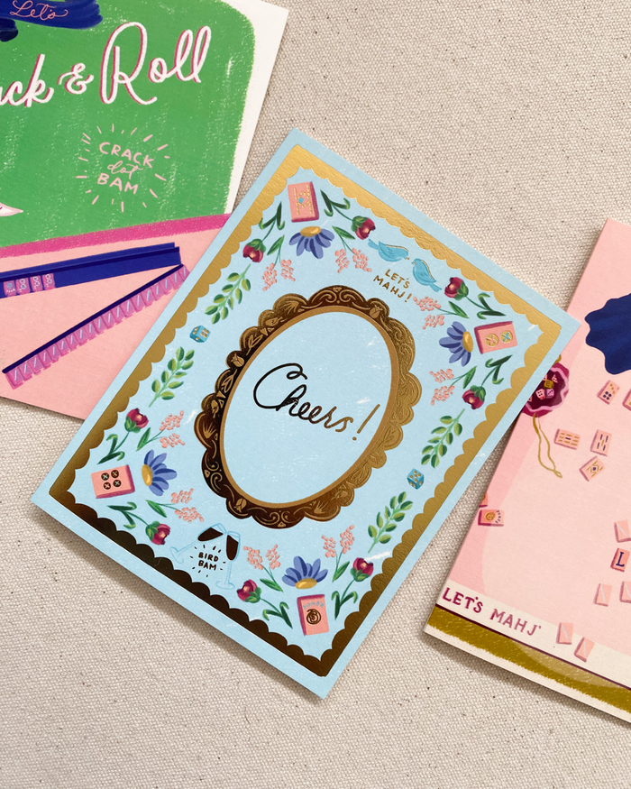 Collection of greeting cards with various designs on a textured surface