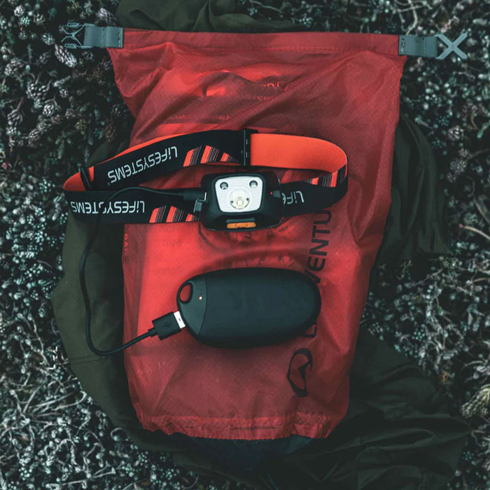 Lifesystems rechargeable hand warmer being used as a bettery bank to recharge a head torch