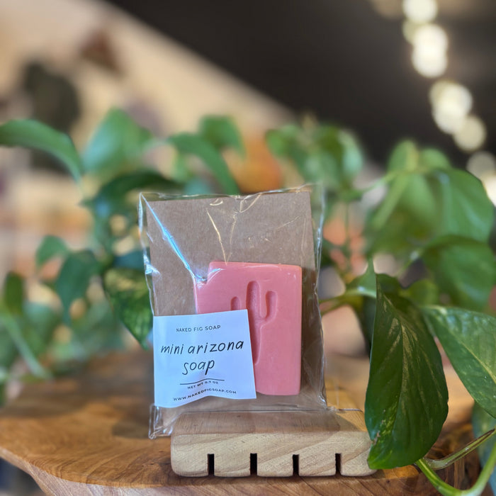Pink mini Arizona soap wrapped in clear packaging with a blue label reading Naked Fig Soap.