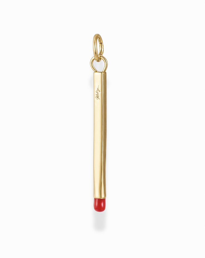 Gold Nelle Matchstick Charm pendant. Stylish, playful jewelry adding a touch of whimsy to your look.