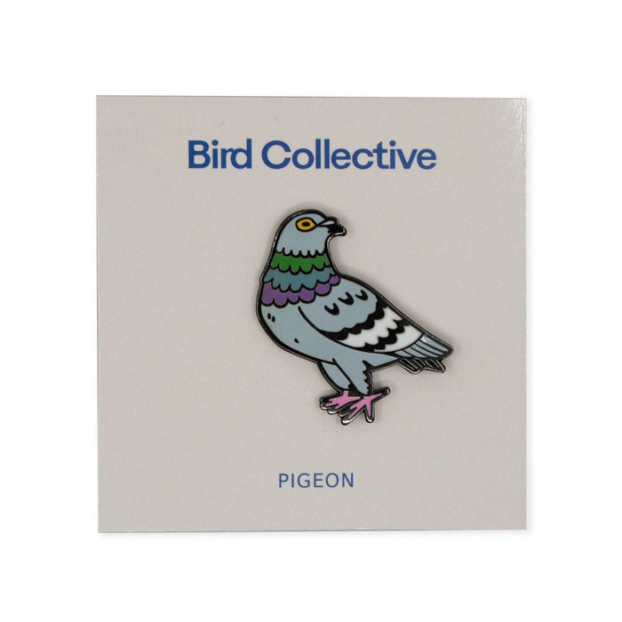 Colorful pigeon enamel pin mounted on a Bird Collective display card