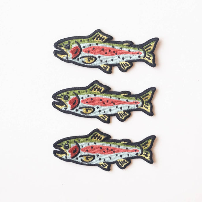 Three embroidered rainbow trout patches with green backs and pink bodies