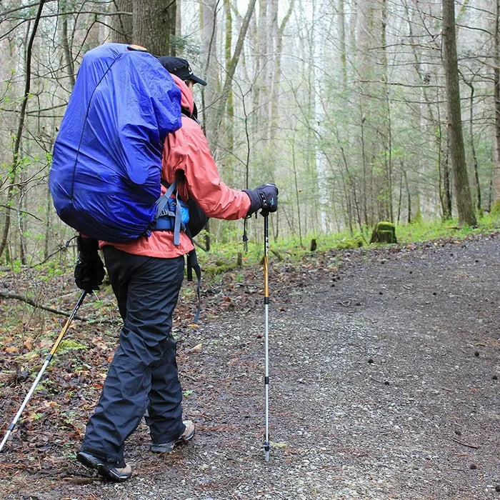 Sea To Summit Ultra-Sil waterproof pack cover fitted over a rucksack on a walkers back in the rain
