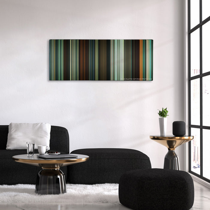 Shame color palette canvas above a black sofa with a gold-topped table