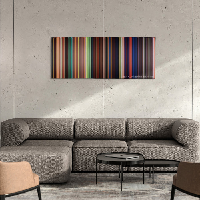 Tangled color palette canvas on a concrete wall above a gray sectional sofa