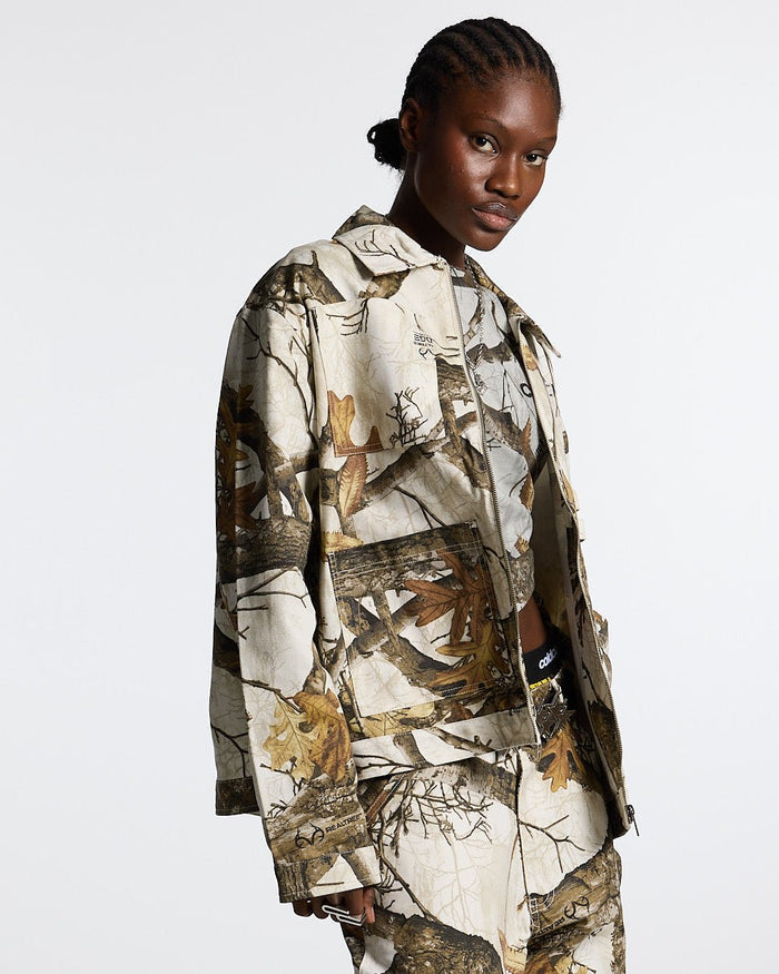 WORK ZIP JACKET REALTREE WHITE - white realtree camo work jacket, front view on female model - Cold Culture #woman