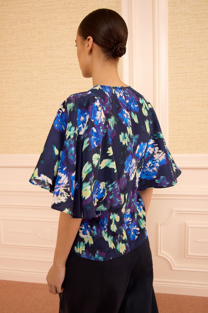 Navy Ikat Floral Silk Blouse - Back View Flared Sleeves On Model | Ulla Johnson