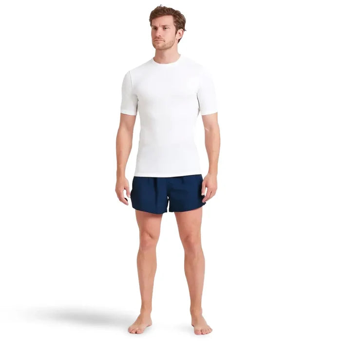 Man wearing a Sub Zero All Active short sleeve aerobic top in white with navy shorts on a white background