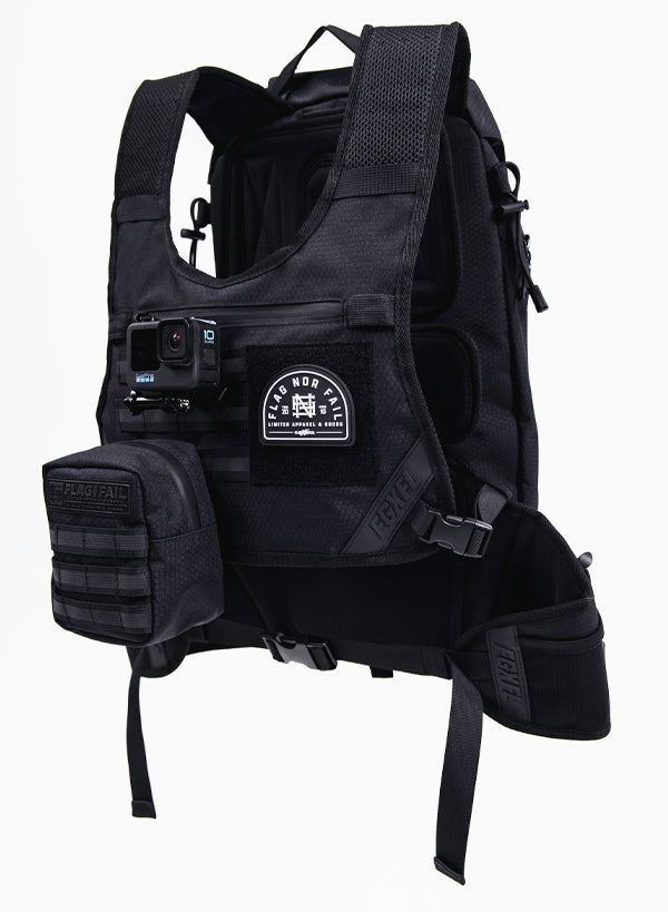 This photo shows how accessories can be added to our Apex bag. Featuring a Go Pro attached via our Apex Go Pro mount.  Our 4 in Apex Utility bag is attached via the tactical webbing and a Flag nor Fail patch in the area for velcro patches.