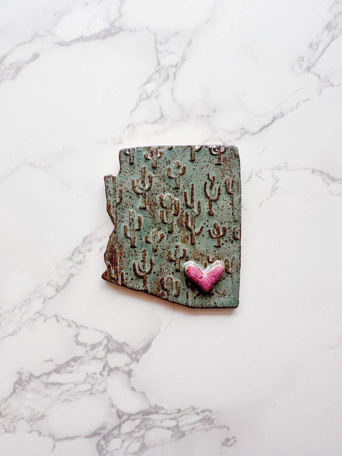 Arizona state shaped ceramic magnet with teal cactus pattern and a pink heart accent
