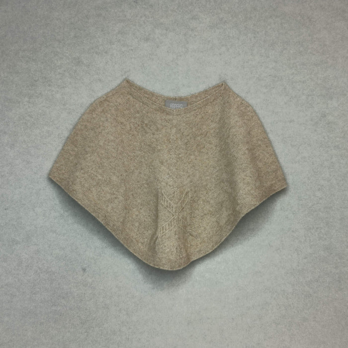 Beige poncho on a gray background