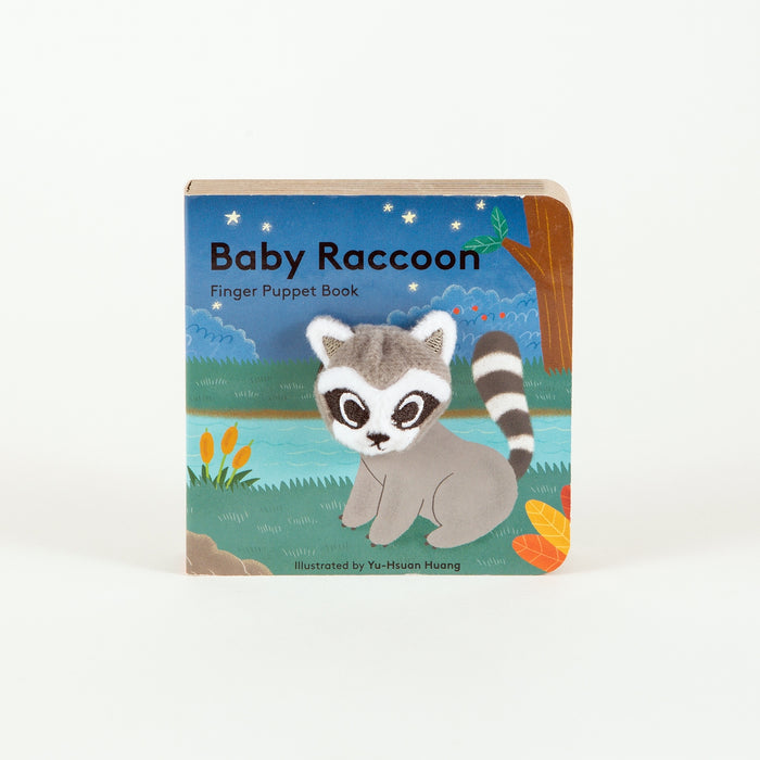 Cover of Baby Raccoon Finger Puppet Book with a plush raccoon in a night scene