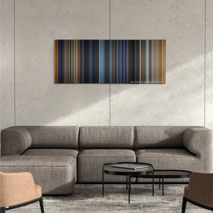 Bad Boys color palette canvas on a concrete wall above a gray sectional sofa