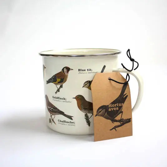 Enamel mug featuring birds with a kraft tag tied to the handle.