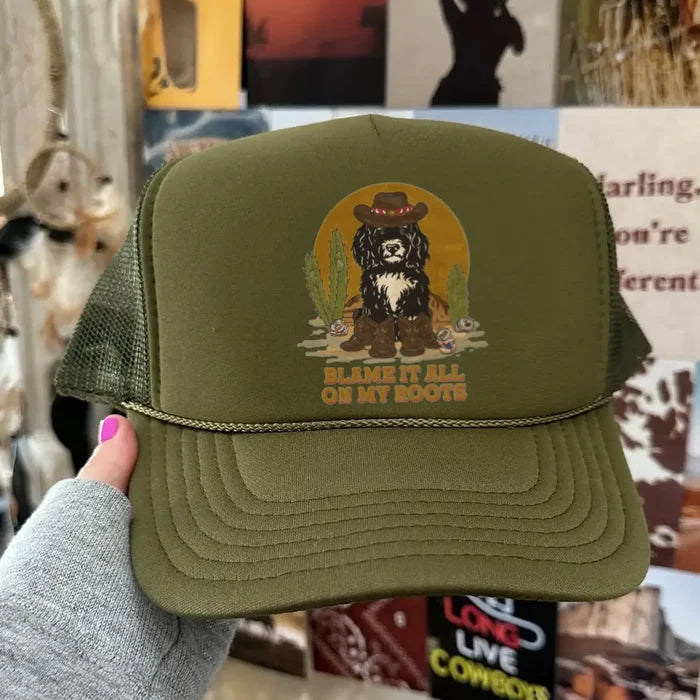 Olive green trucker hat with a desert scene and a dog in a hat Blame It All On My Roots