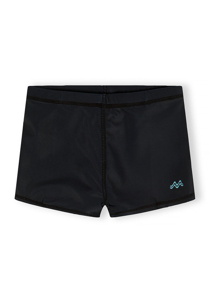 Boys swim shorts in solid black, front view, featuring a logo badge.