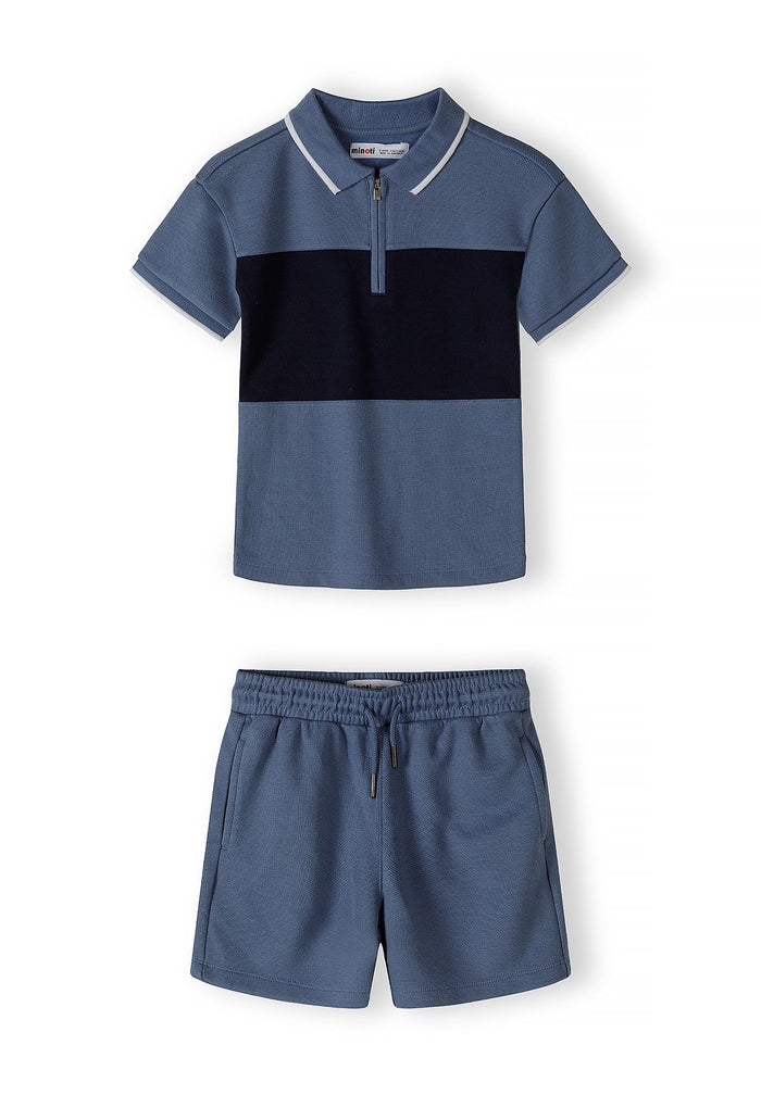 Boys navy blue polo shirt with zip collar and matching shorts, front view.