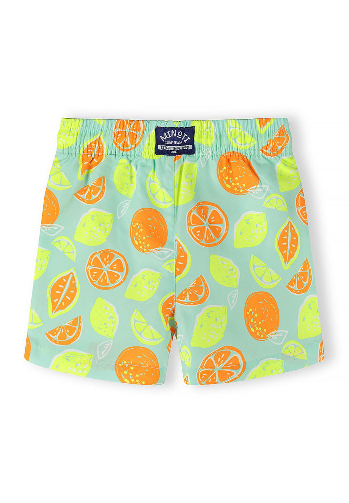 Boys' swim shorts in mint with lemon and orange fruit pattern, back view, elastic waistband.