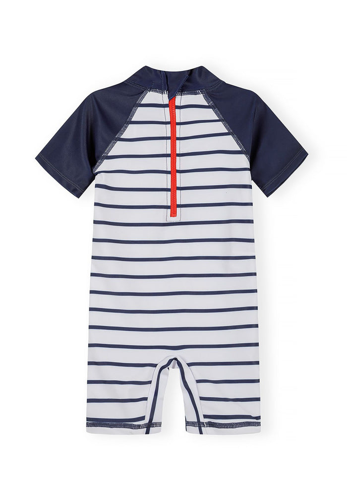 Back view of a boys' short sleeve rash suit with marine stripes and a red zip.