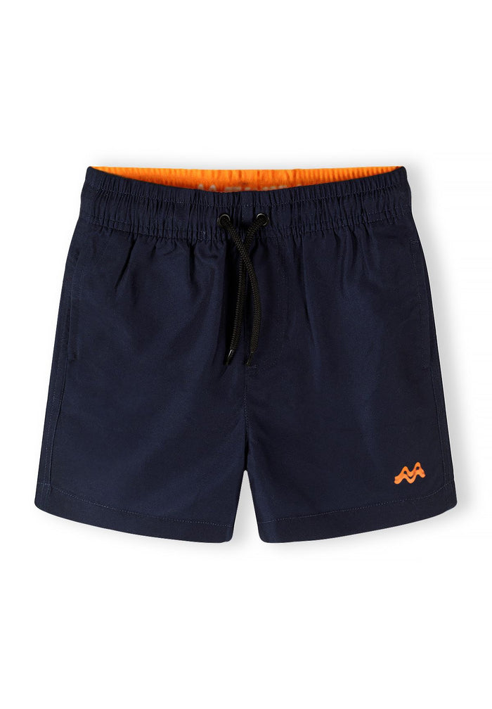 Boys swimming shorts in navy with bright orange lining, front view, featuring elasticated waistband and drawstring.
