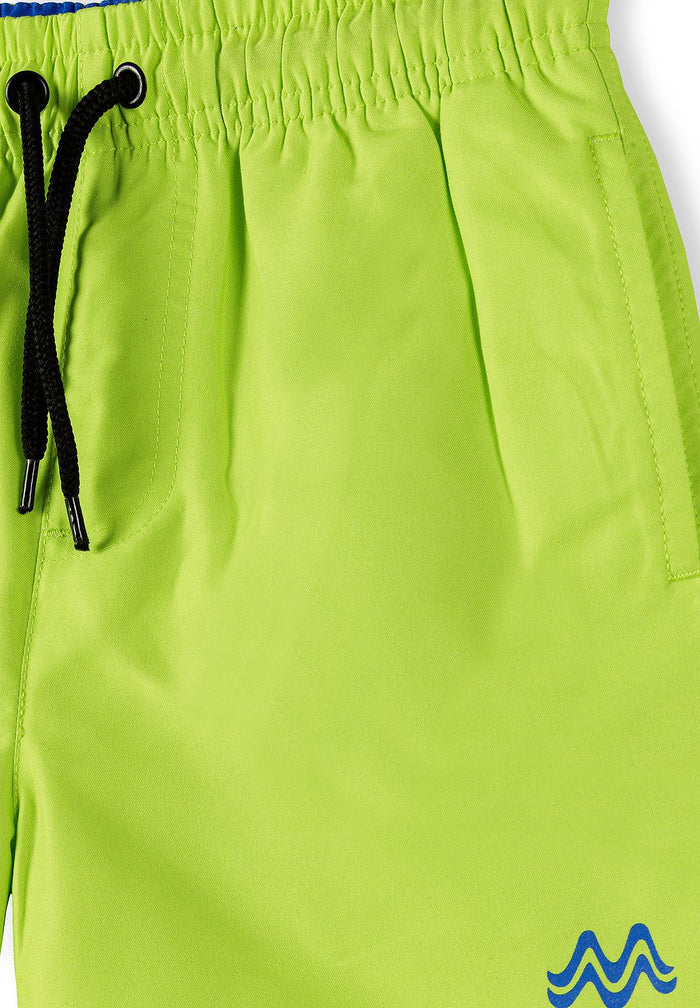Detail of lime swimming shorts with elasticated waist and drawstring.