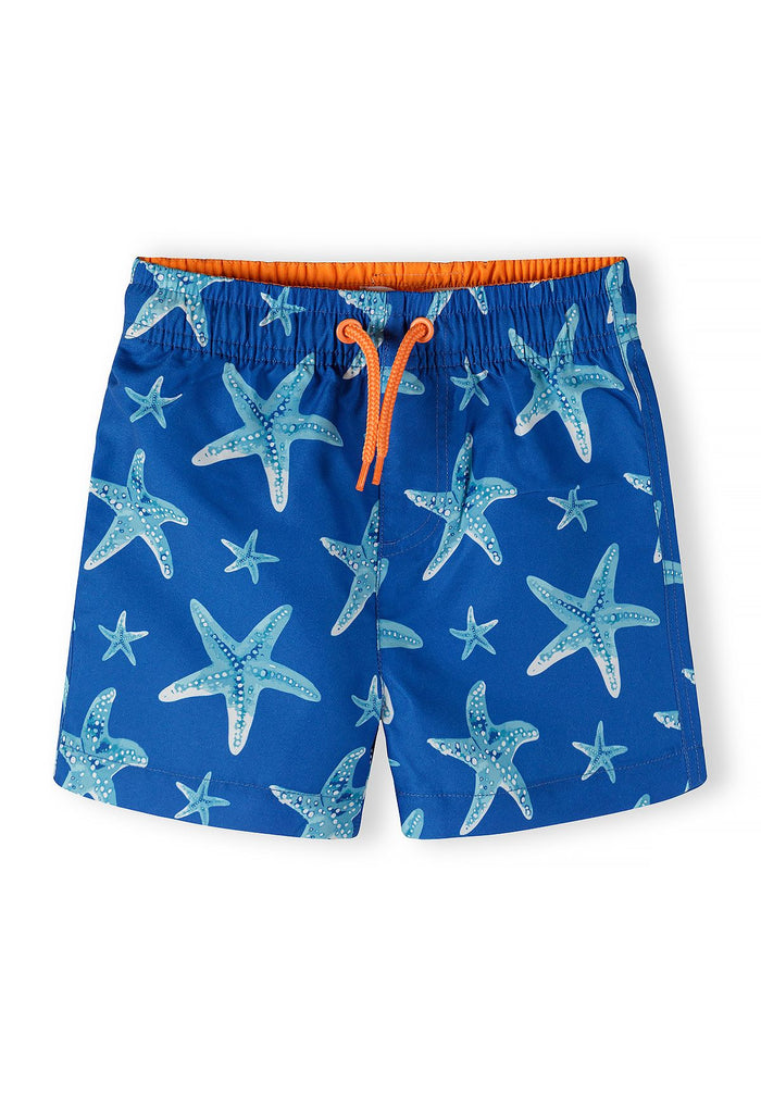 Boys swimming shorts in royal blue with starfish print, front view, featuring an elasticated waistband and drawstring.