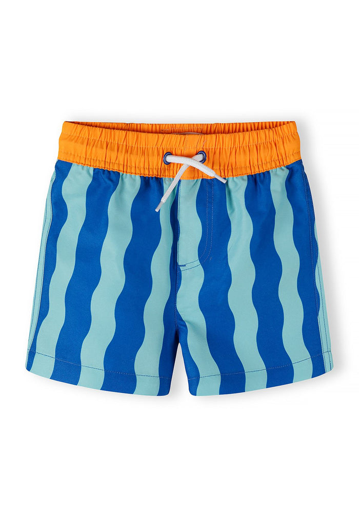 Boys swimming shorts in blue with wavy pattern, front view, featuring elastic waistband and drawstring.