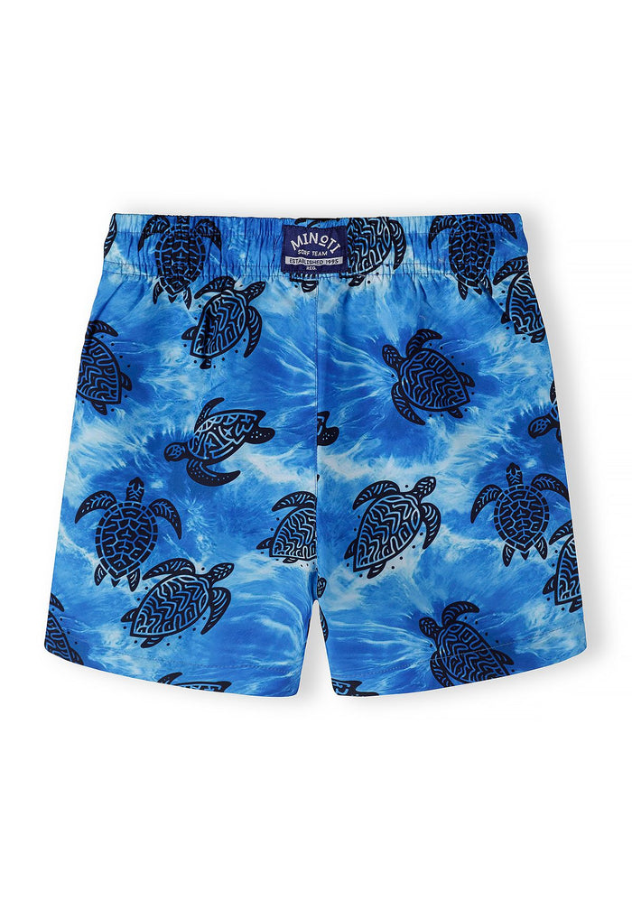 Boys' blue swimming shorts with turtle motif, front view.