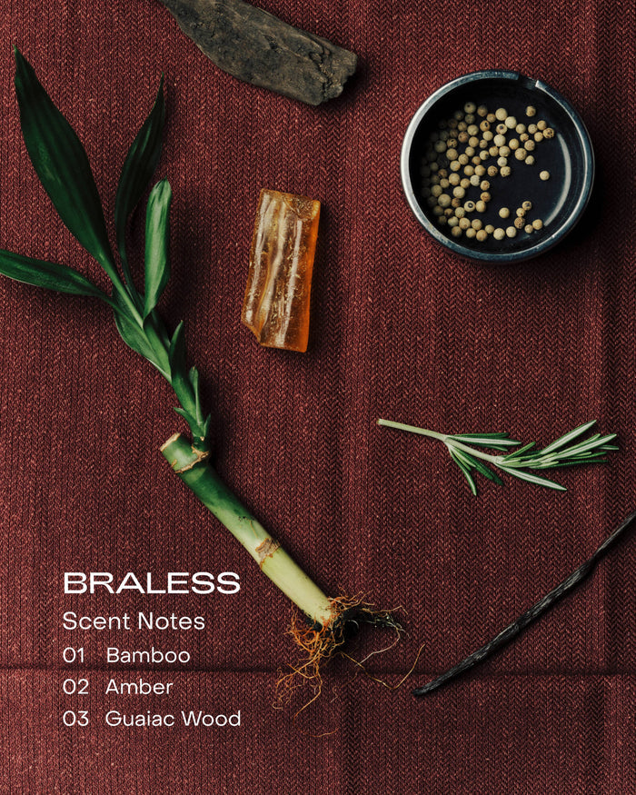 Braless product display with bamboo, amber, and guaiac wood on a brown fabric background