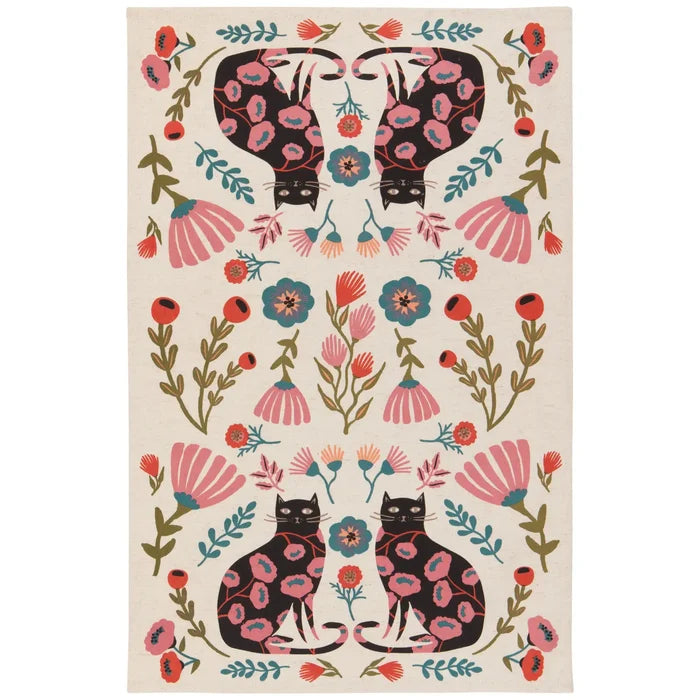 Catbloom dish towel with two black cats bearing pink floral patterns amid a colorful floral border.