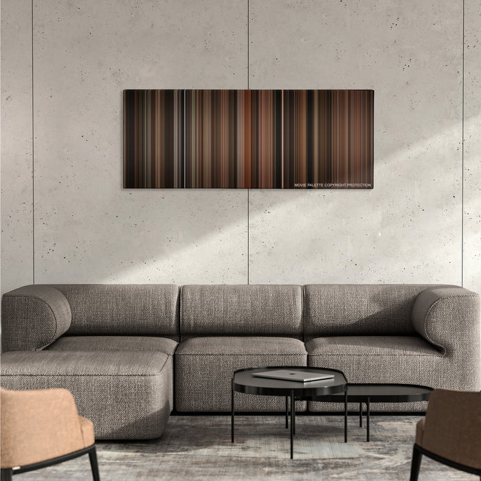 Cinderella Man color palette canvas on a concrete wall above a gray sectional sofa