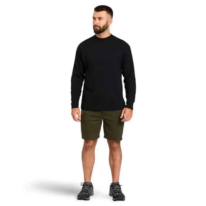 Man wearing a black Sub Zero Cool T wicking long sleeve shirt and green trek shorts on a white background