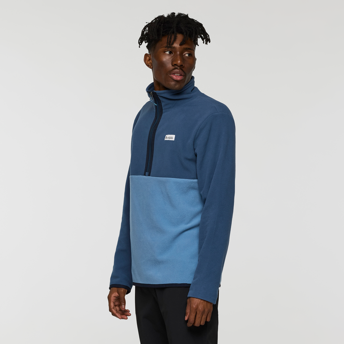 Male model in blue Amado Fleece Pullover with zip neck posing in studio