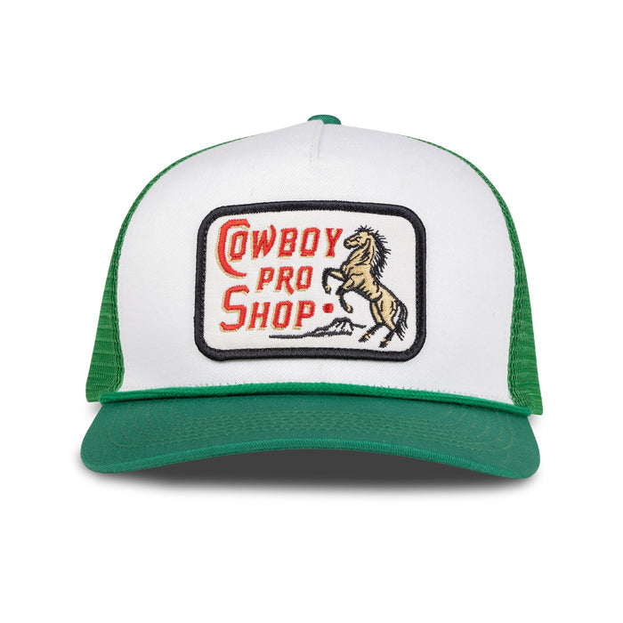 Cowboy Pro Shop hat with a white front panel and green brim featuring an embroidered patch.