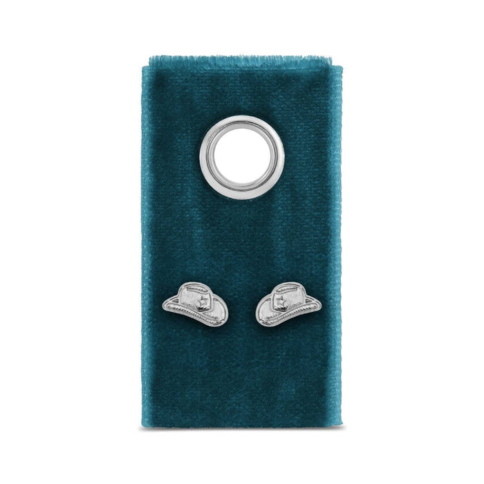 Pair of silver cowgirl hat stud earrings on teal velvet display