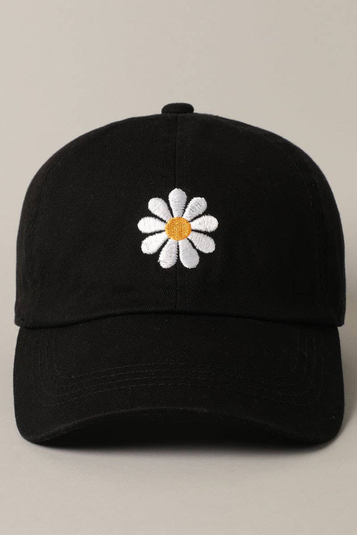 Black adjustable cap with white daisy embroidery and orange center