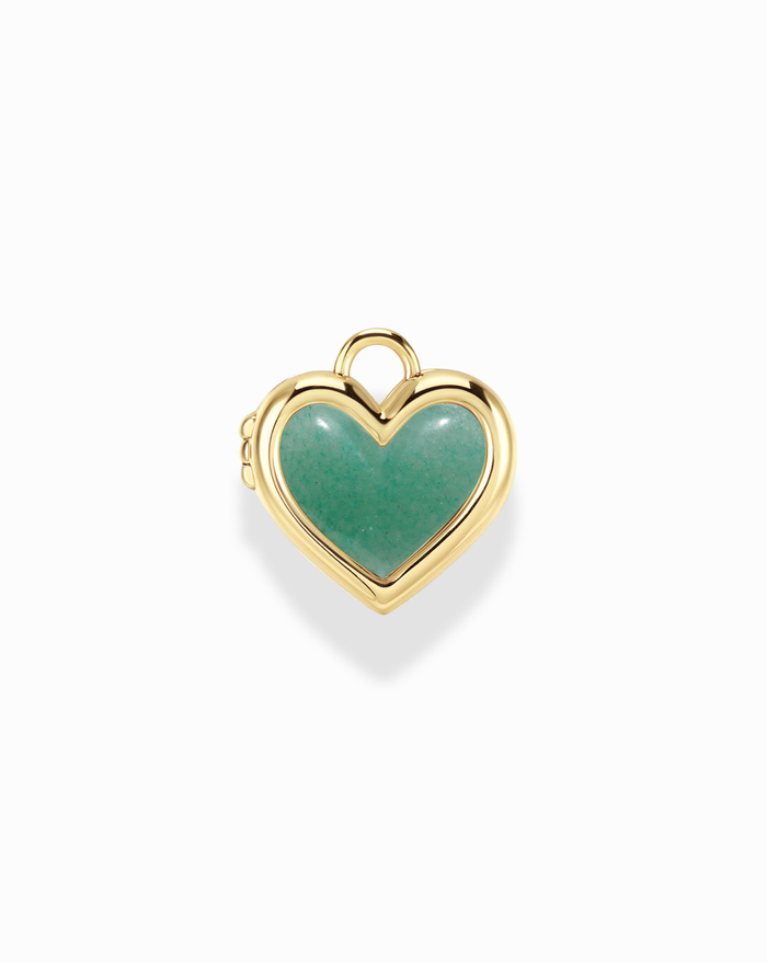 Heart-shaped pendant with gold frame and green stone on a white background