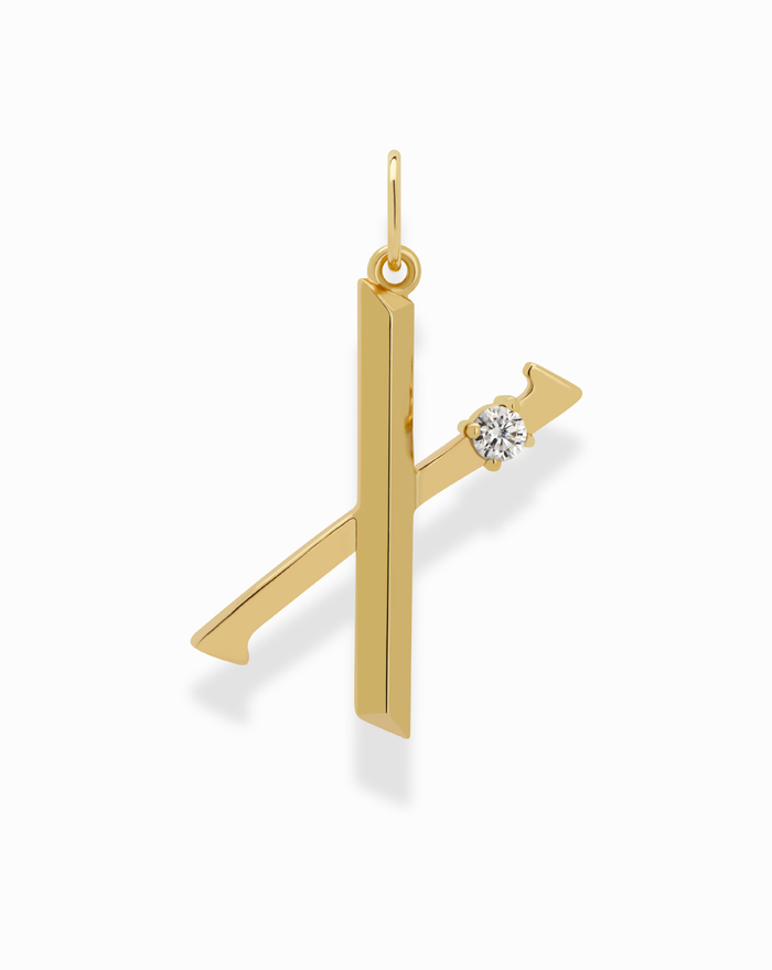 The Eloise Letter Charm by Mod + Jo is a gold K-shaped charm with a small round cubic zirconia accent on the upper right, set against a white background.