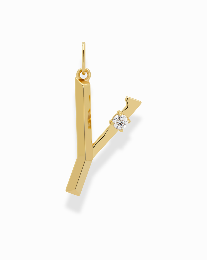 The Eloise Letter Charm by Mod + Jo is a gold pendant shaped like the initial Y, featuring a small cubic zirconia accent on the right arm, displayed against a plain white background.
