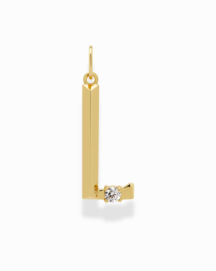 The Eloise Letter Charm by Mod + Jo is a gold “L”-shaped pendant with a small round diamond at the base, hanging from a circular bail against a white background.