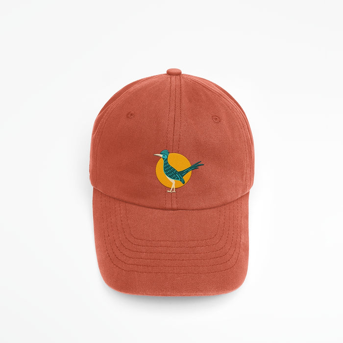 Embroidered roadrunner logo on a burnt orange baseball cap
