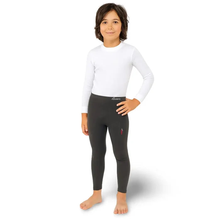 Child wearing a white long-sleeve shirt and Sub Zero Factor 1 Plus black base layer leggings on a white background