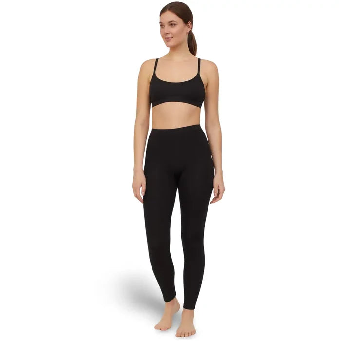 Woman wearing a black sports bra and Sub Zero Factor 1 Plus Stretch leggings in black on a white background