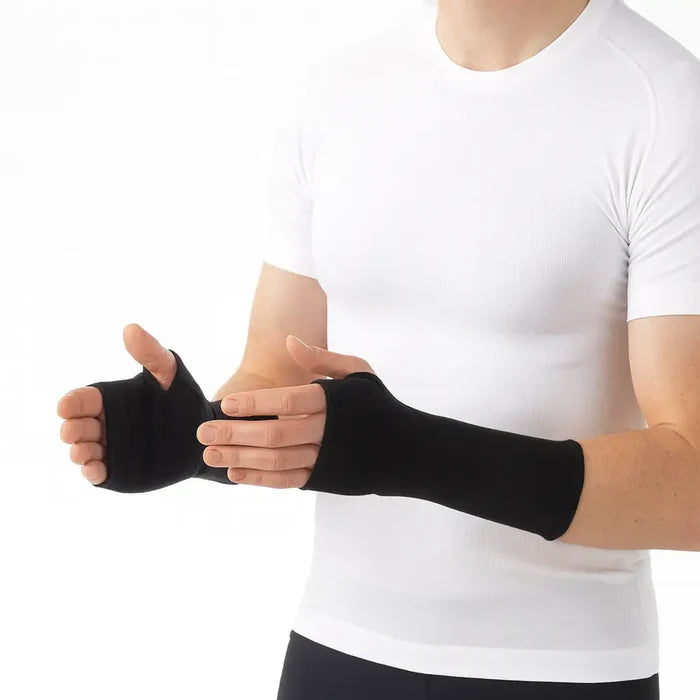 Person wearing black Sub Zero Factor 1 Plus thermal wrist warmers on a white background