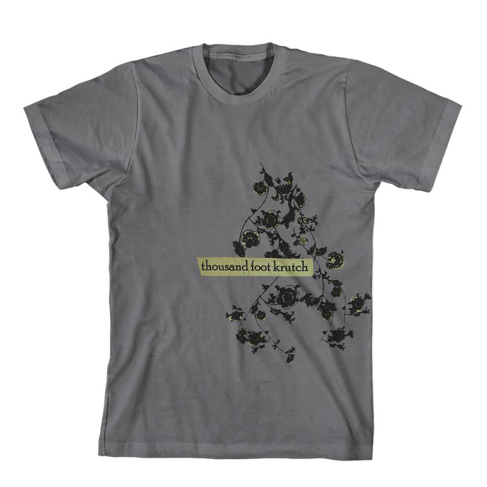 A gray Thousand Foot Krutch t-shirt featuring a floral vine design and the bands name in a yellow-green rectangle on the front.