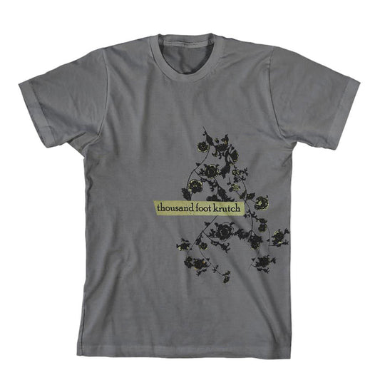 A gray Thousand Foot Krutch t-shirt featuring a floral vine design and the bands name in a yellow-green rectangle on the front.
